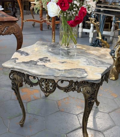 Small ornate coffee table with onyx marble top and metal base
