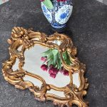 Ornate gold Rococo revival wall mirror