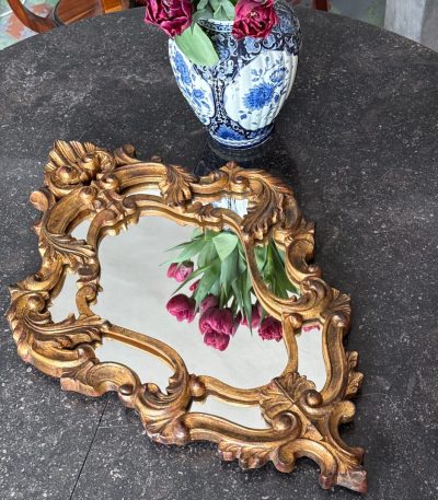 Ornate gold Rococo revival wall mirror