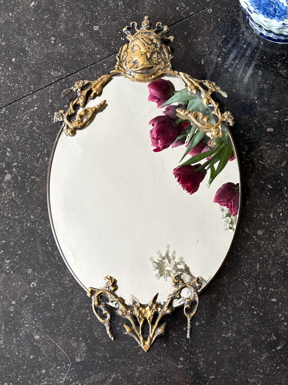 IMG_0360 Antique French Neo-Renaissance small oval brass wall mirror detailed with a sculpted profile cameo of a noble woman and ornate openwork scroll details.