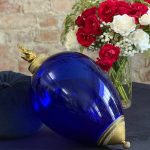Beautiful dark blue glass decor with ornate bronze mounts and a sculptural flame finial in Empire style.