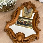 Antique French Chippendale style walnut wall mirror featuring hand-carved rose flowers