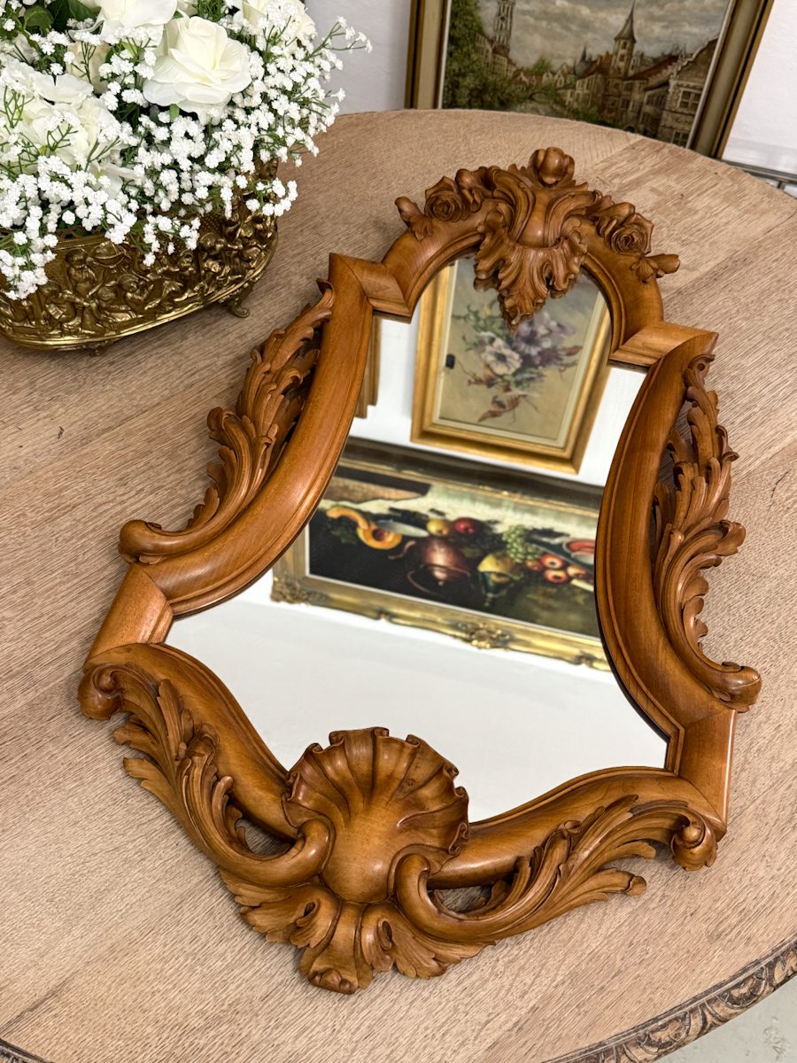 Antique French Chippendale style walnut wall mirror featuring hand-carved rose flowers