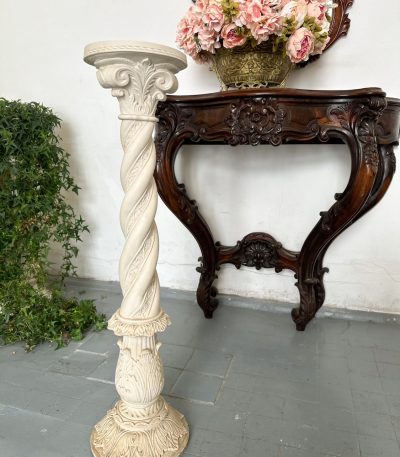 White cast stone pedestal column with spiral twist shaft and Corinthian acanthus capital