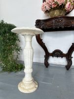 Carved alabaster pedestal column with fluted baluster shaft and leaf-carved top
