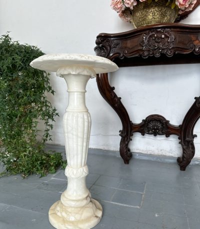Carved alabaster pedestal column with fluted baluster shaft and leaf-carved top