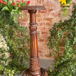 Carved walnut plant stand pedestal column with acanthus capital and round base