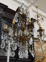 antique brass and crystal eight arm chandelier with cherub angels detailing