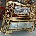 Exquisite late 20th-century neoclassical style bed featuring a heavy golden metal frame