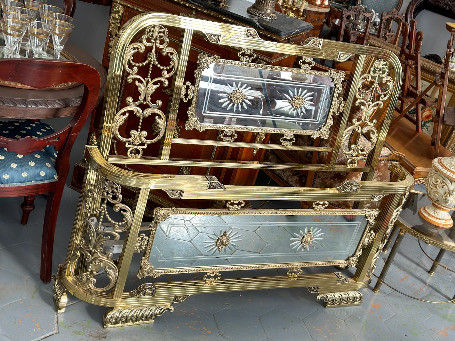 Exquisite late 20th-century neoclassical style bed featuring a heavy golden metal frame