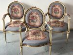 Antique French Louis XVI style carved and painted medallion armchairs with tapestry upholstery