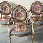 Antique French Louis XVI style carved and painted medallion armchairs with tapestry upholstery