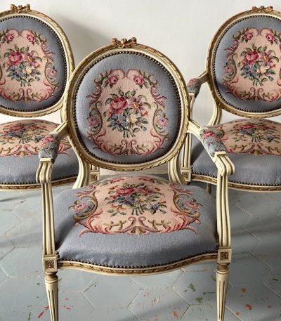 Antique French Louis XVI style carved and painted medallion armchairs with tapestry upholstery
