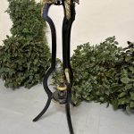 Ebonised gueridon pedestal with gilt bronze jackal heads and rococo ormolu mounts