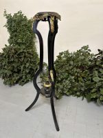 Ebonised gueridon pedestal with gilt bronze jackal heads and rococo ormolu mounts