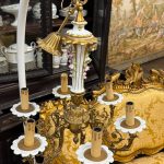 antique brass and porcelain six arm chandelier with ceramic flowers