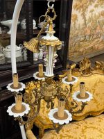 antique brass and porcelain six arm chandelier with ceramic flowers