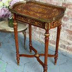 Antique Louis XVI style mahogany side table with floral marquetry inlay and brass gallery