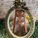 antique oval giltwood frame with birds and flowers
