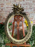 antique oval giltwood frame with birds and flowers