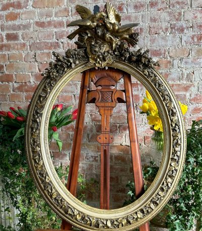 antique oval giltwood frame with birds and flowers