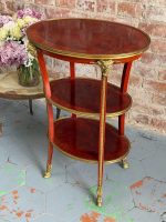 Antique Louis XVI style mahogany three-tier side table with bronze ram heads