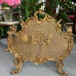 Antique gilt-bronze firescreen with cherubs and rococo scrolls