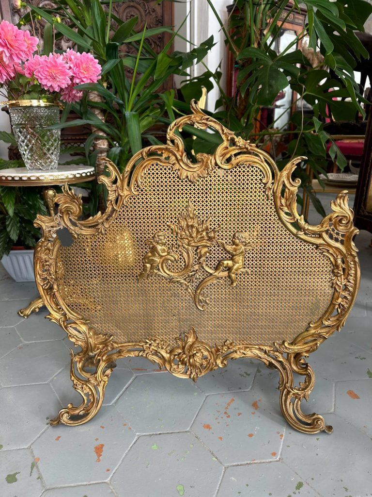 Antique gilt-bronze firescreen with cherubs and rococo scrolls