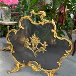 Antique gilt-bronze rococo firescreen with cherubs and flaming-urn motif