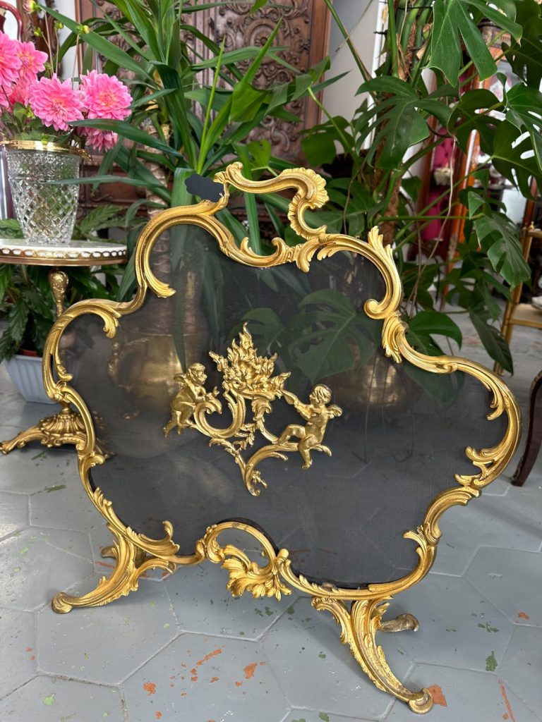 Antique gilt-bronze rococo firescreen with cherubs and flaming-urn motif