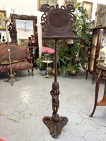 Antique hand carved wood lectern music stand featuring a detailed cherub angel holding a twisted column on an ornate tripod base.