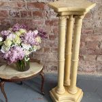 Alabaster pedestal column with three pillars and carved capitals on shaped base