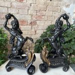 Pair of antique centaur chenets in patinated cast iron with gilt rococo bases