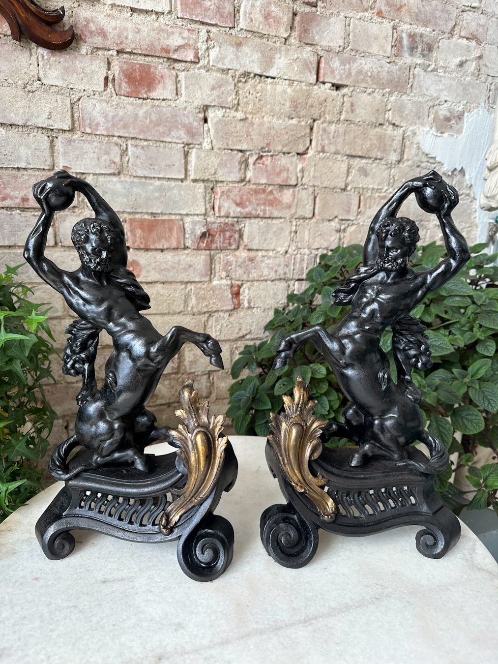 Pair of antique centaur chenets in patinated cast iron with gilt rococo bases