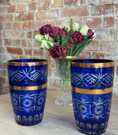 Cobalt blue cut-to-clear crystal vase with wide gold bands and star cut patterns