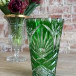 Vibrant emerald green cut-to-clear crystal vase with classic star and diamond patterns