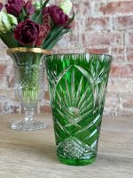 Vibrant emerald green cut-to-clear crystal vase with classic star and diamond patterns