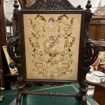 Antique carved oak needlework firescreen with silk embroidered panel
