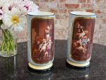 2 medium size porcelain vases with painted putti scenes