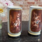 2 medium size porcelain vases with painted putti scenes