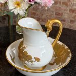 limoges porcelain pitcher and basin set with heavy gold floral detailing signed by m. caffy