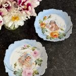 Antique porcelain wall plates pair with floral maiden portraits