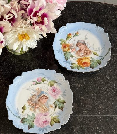 Antique porcelain wall plates pair with floral maiden portraits