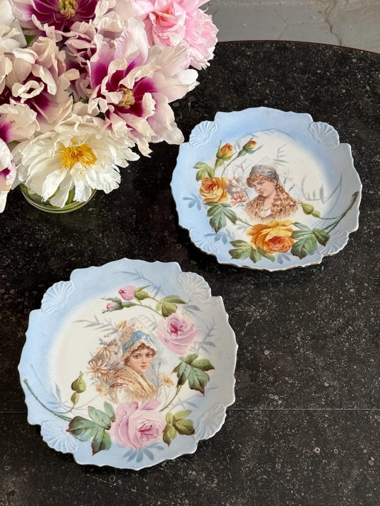 Antique porcelain wall plates pair with floral maiden portraits