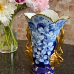 Beautiful blue limoges porcelain vase with hand-painted floral motif and ornate gold handles in Neo-Rococo style.