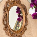 Carved wood oval mirror with acanthus scrollwork