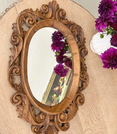 Carved wood oval mirror with acanthus scrollwork