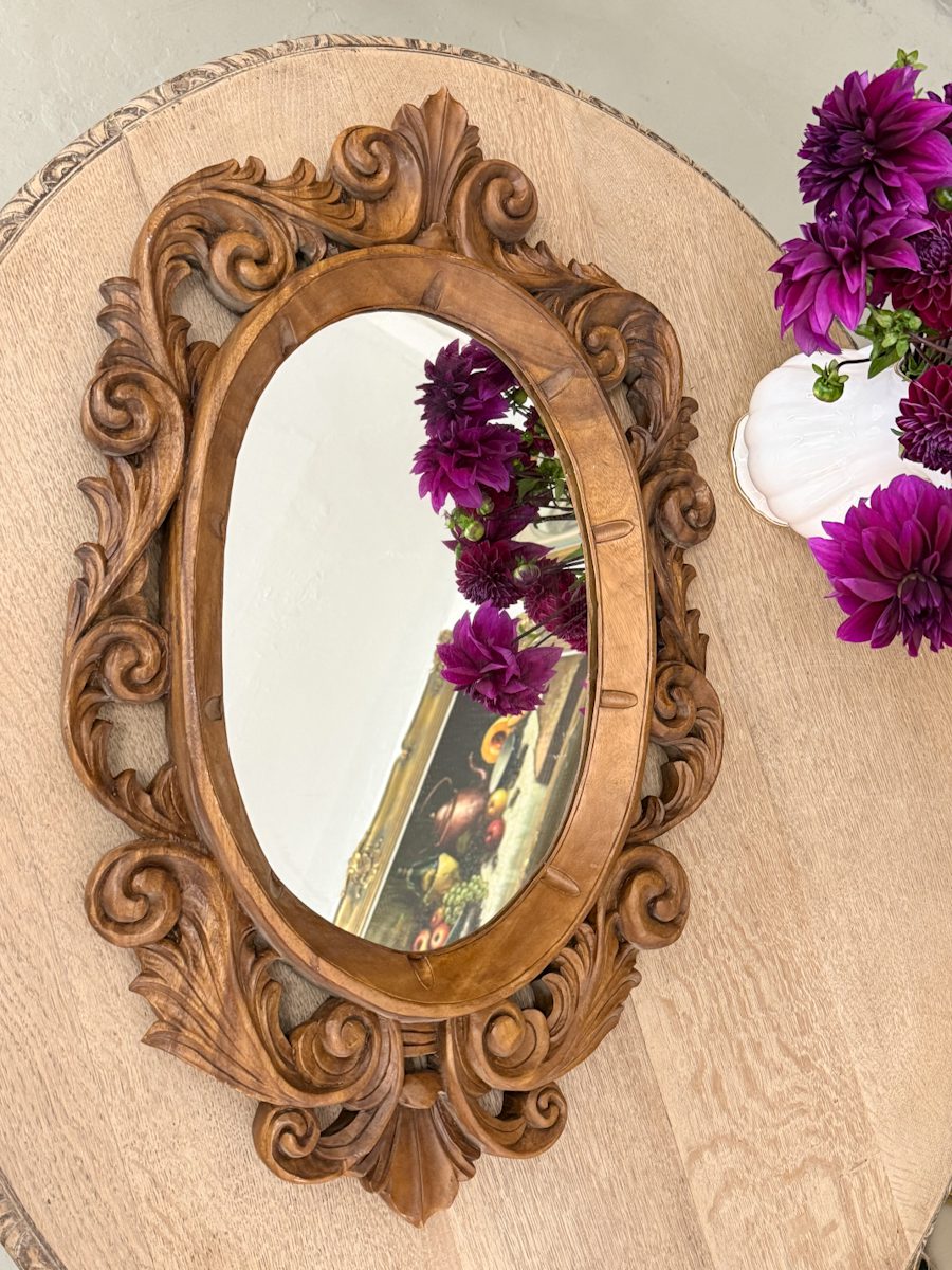 Carved wood oval mirror with acanthus scrollwork