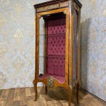antique wooden display cabinet with bronze mounts