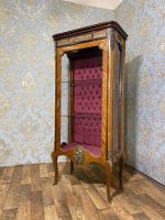 antique wooden display cabinet with bronze mounts